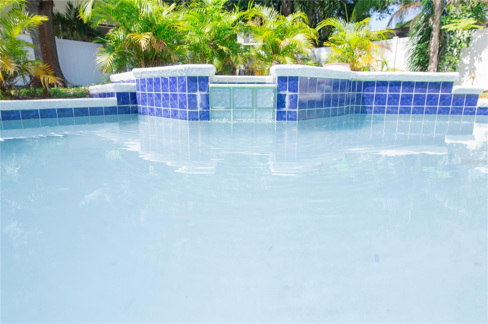 SPILL-OVER SPA INTO THE CUSTOM-SHAPED 11' x 23' POOL.