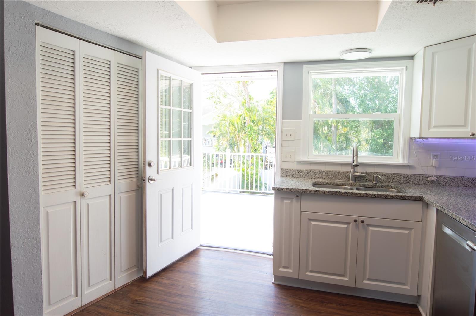 LET THE SUNSHINE IN! ENJOY BREAKFAST ON THE PATIO DECK THAT OVERLOOKS THE BACKYARD OASIS. BOSCH DISHWASHER, REFRIGERATOR, MICROWAVE, RANGE, WASHER AND DRYER ALL STAY WITH HOME.