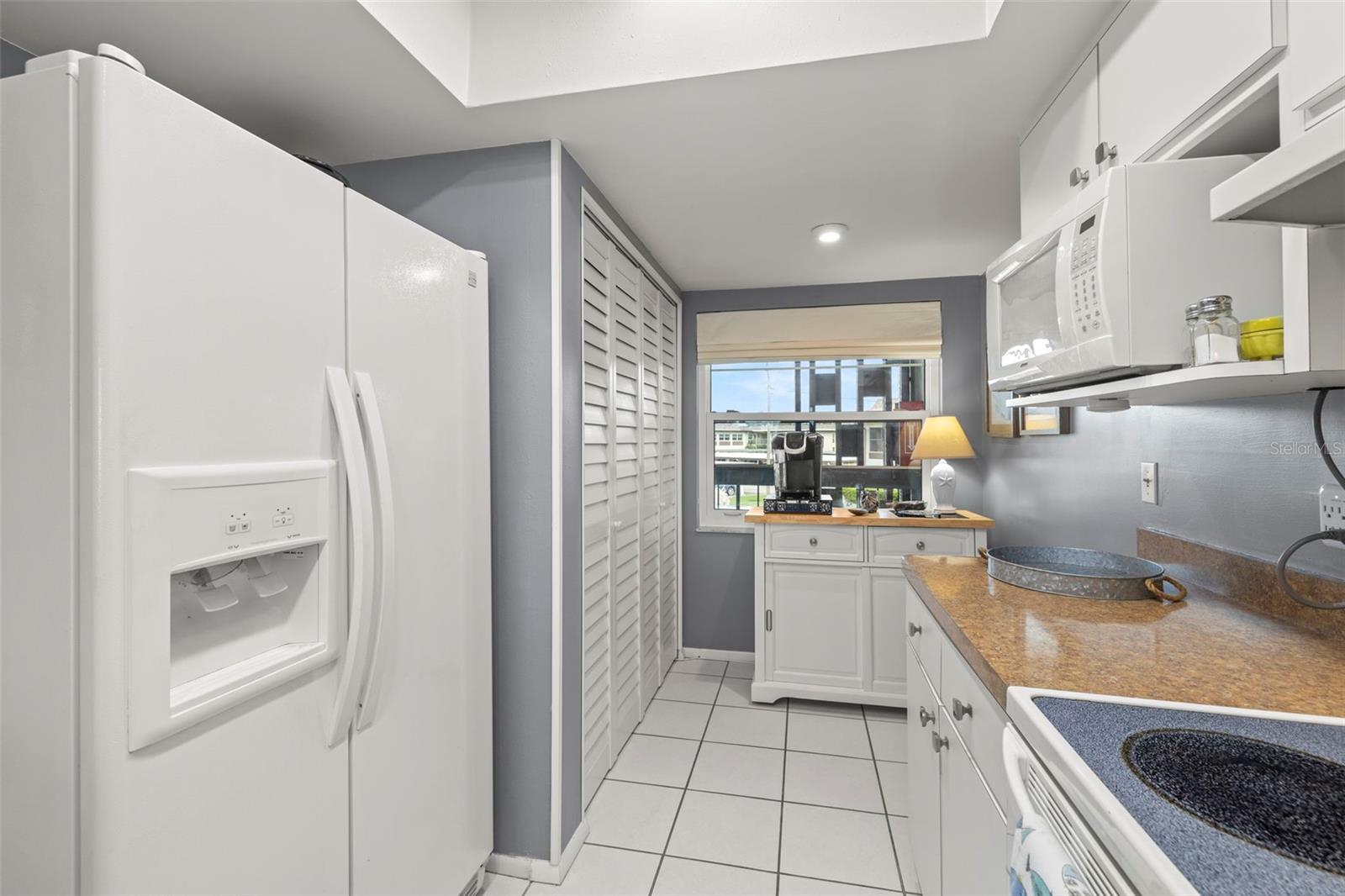 The kitchen includes room for a bistro set or more storage as pictured.