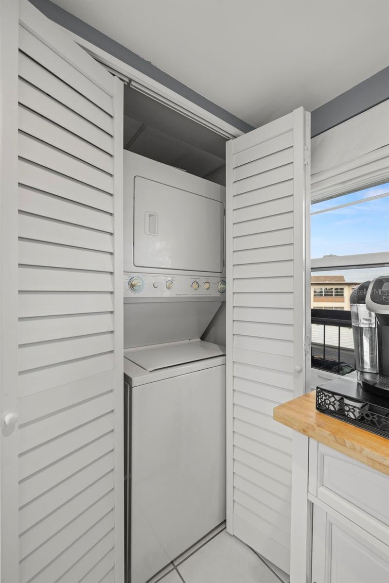Stackable washer & dryer included.