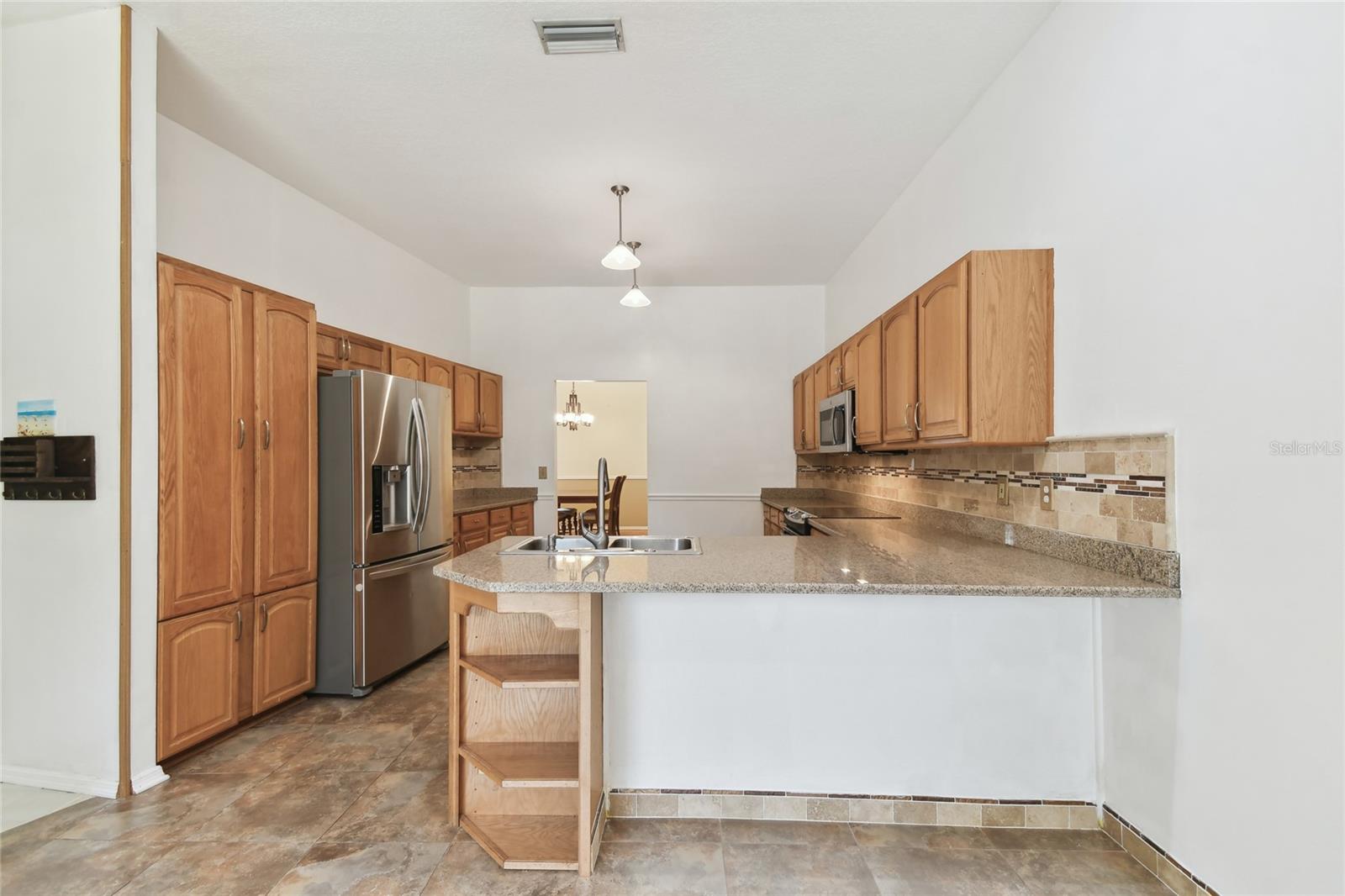 Kitchen view from Dinette and Living areas