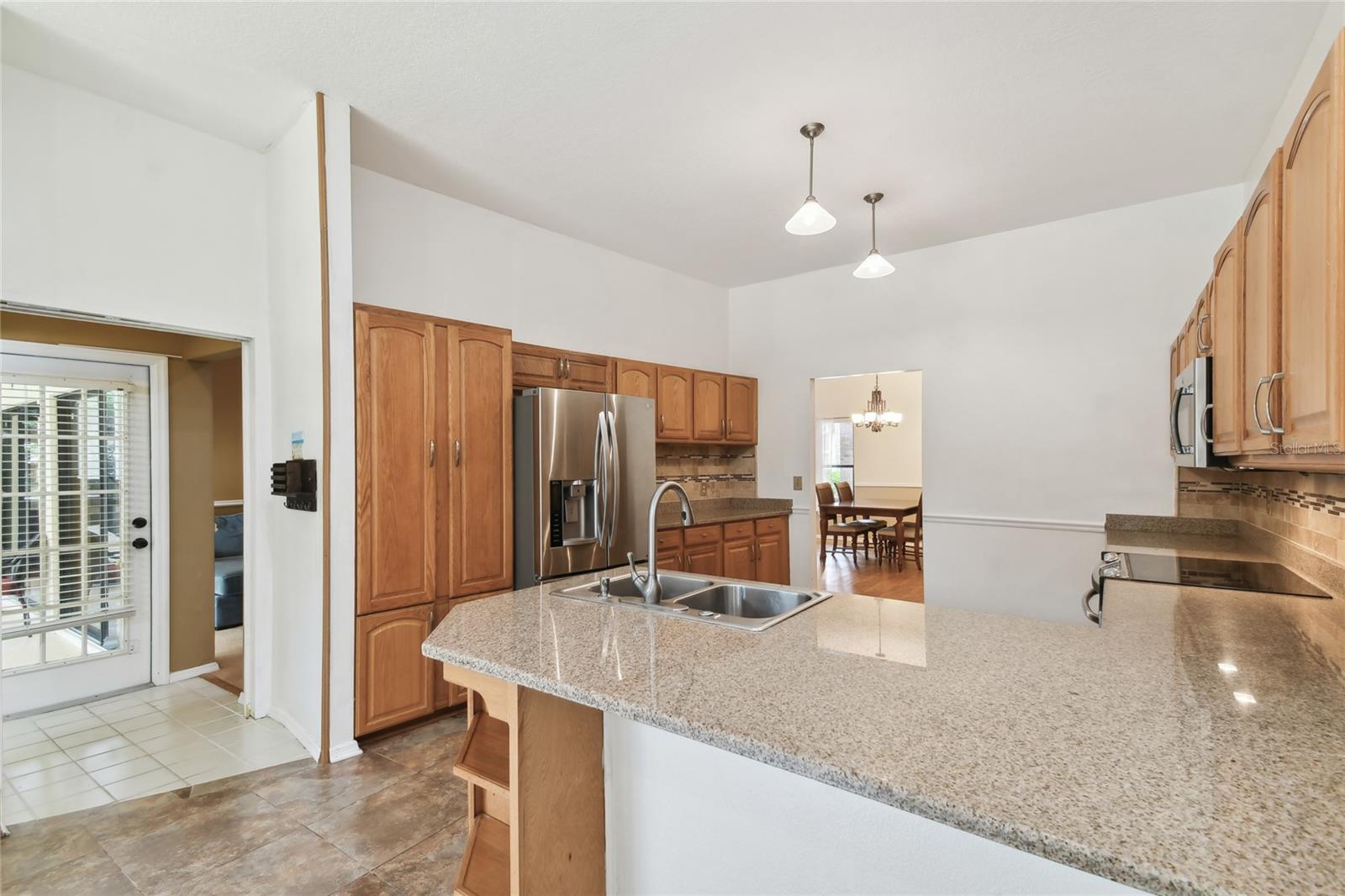 View of access to pool, flex room, 3rd bedroom