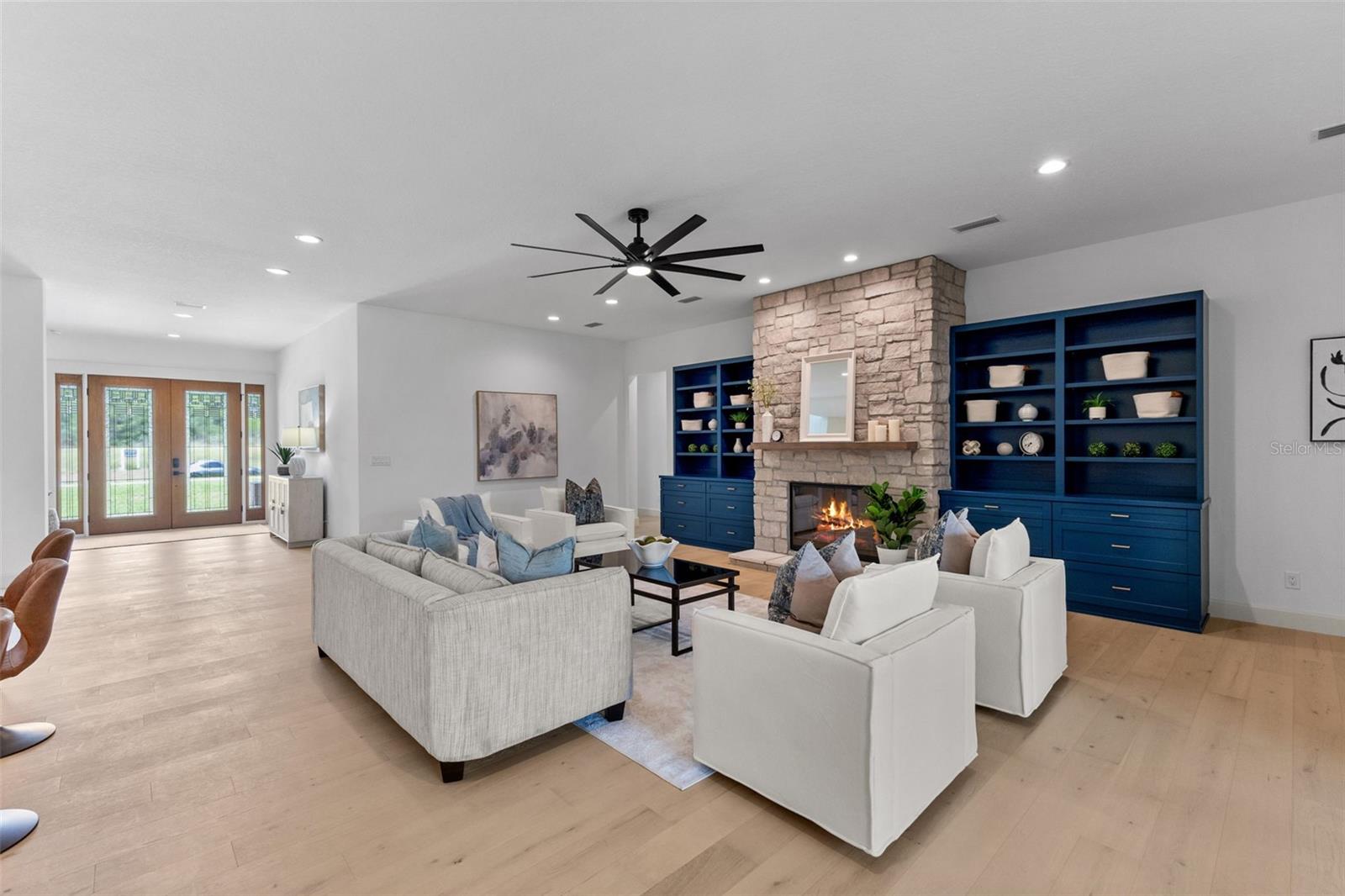 Great room with built in cabinets for additional storage