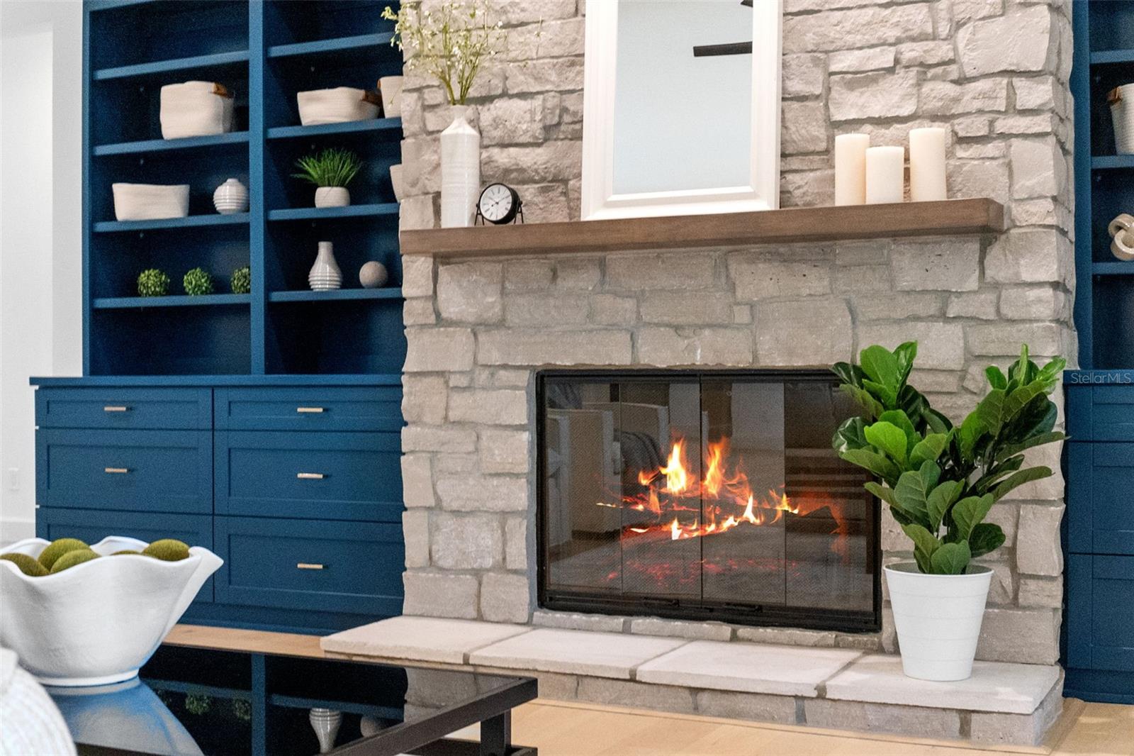 Stone fireplace that is wood burning and can be converted to gas