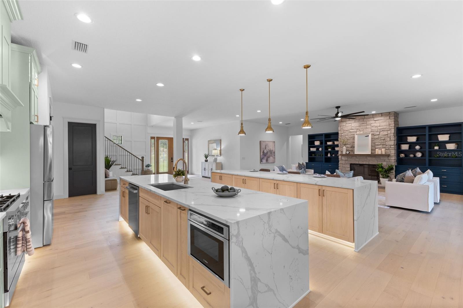 View of the islands with the under counter microwave, all stainless steel Bosh appliances