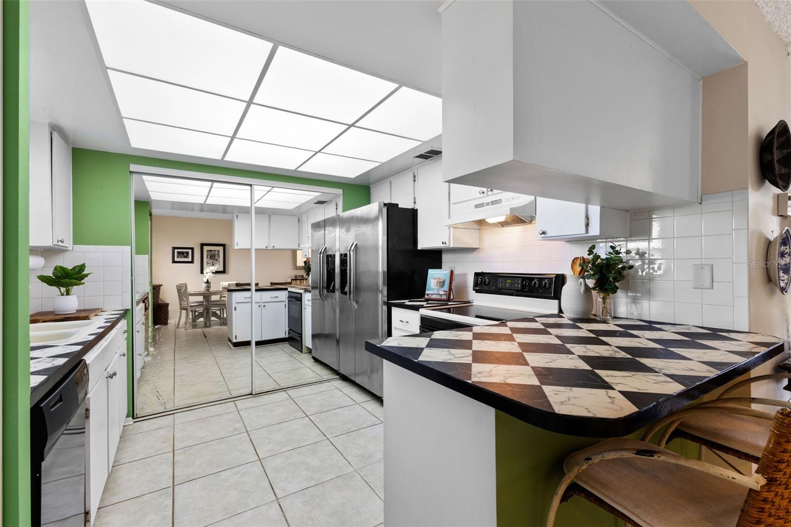 Kitchen with a full wall pantry