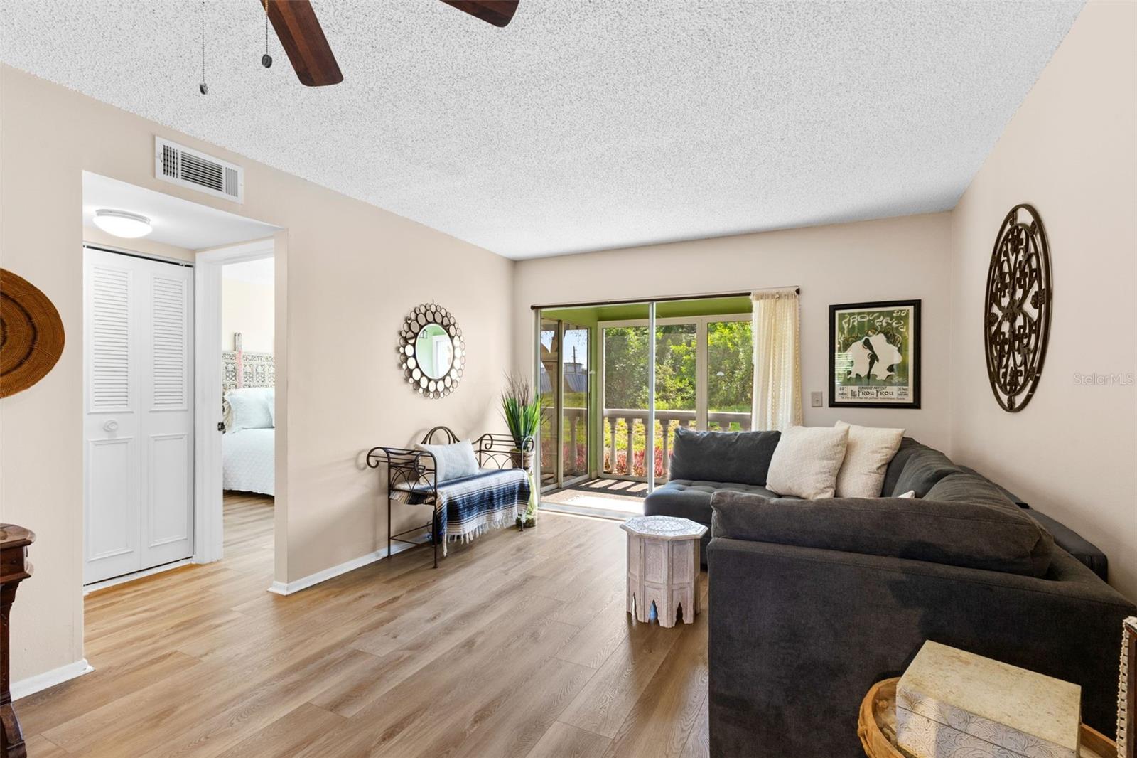 Living Room with sliding glass door opening up to the lanai