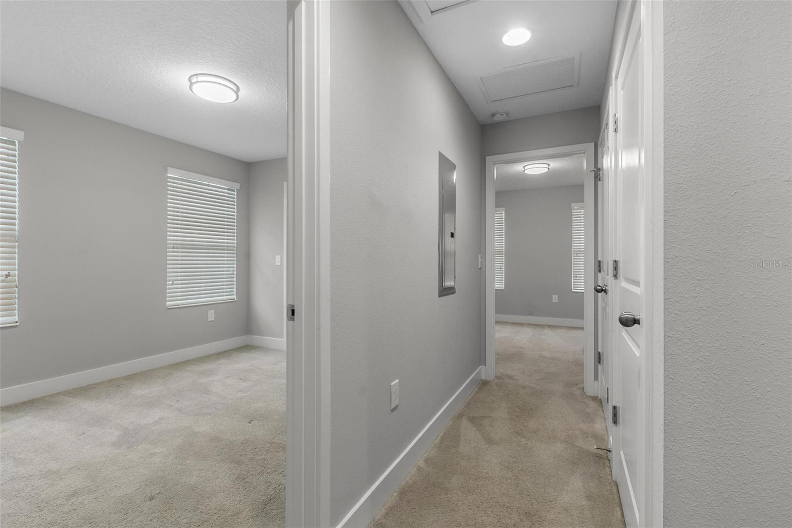 Hallway between all bedrooms, door for AC handler and W/D closet