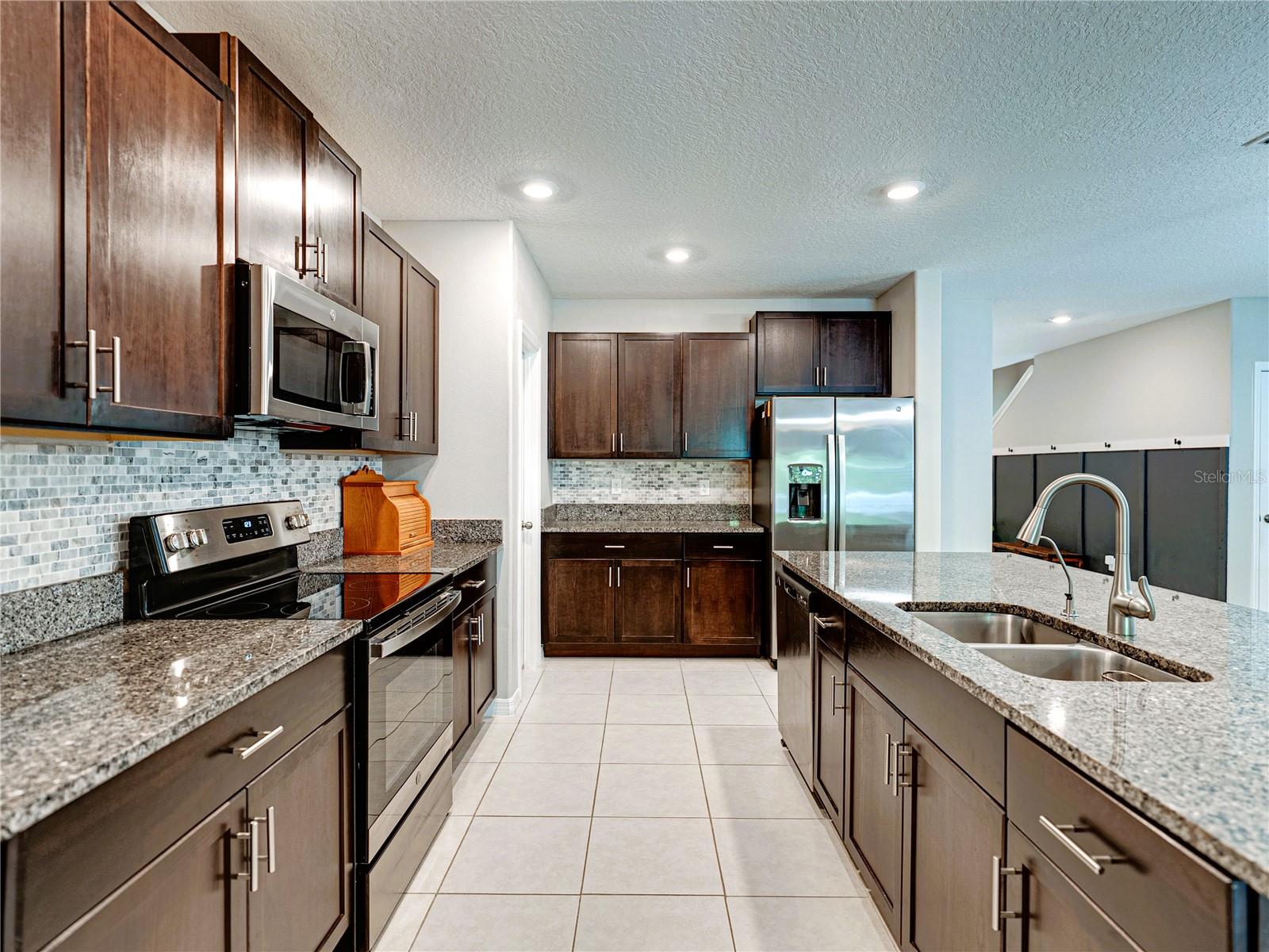 Beautiful Granite Counters and tile Backsplash