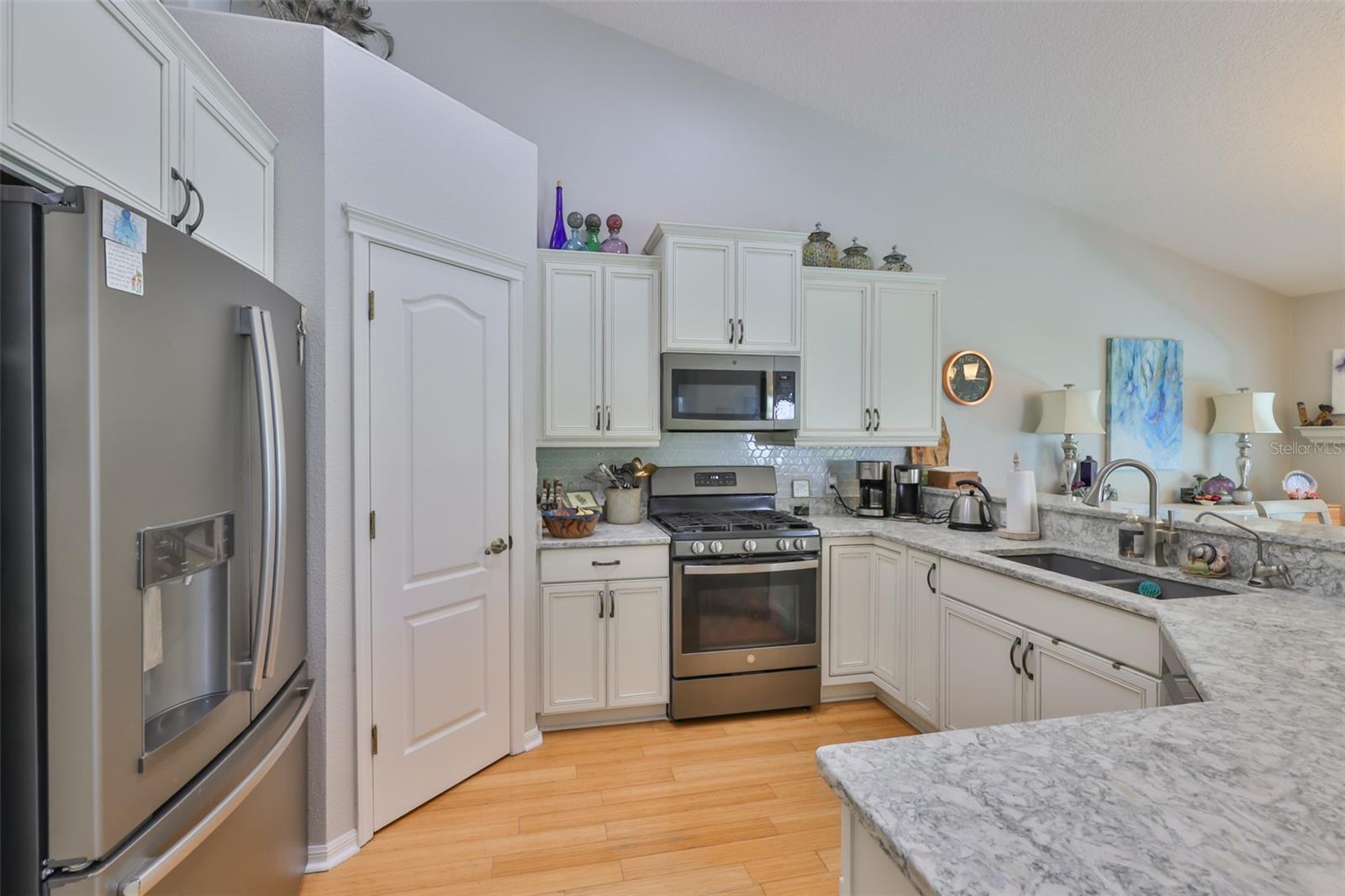 Walk-in pantry, Gas Range, Stainless Steel appliances including a French Door Refrigerator