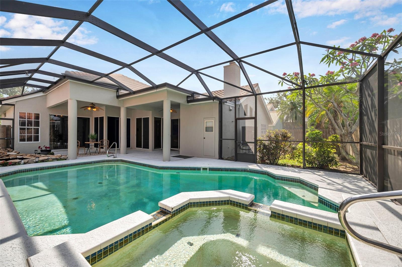 Screen enclosed pool and spill over spa. Note that they do need to be resurfaced and just ask for the estimate for that from Neikens Pool and Spa.
