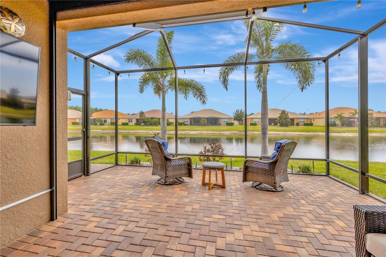 Lanai with enclosure screen with lake view