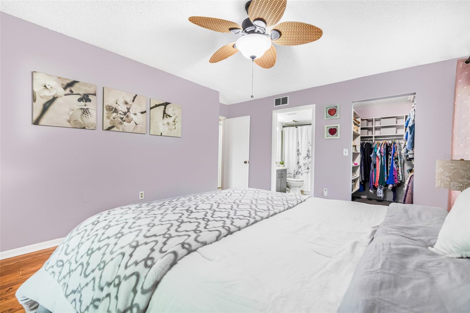 The master bedroom features a custom-designed walk-in closet, perfect for organizing your wardrobe, along with a private en-suite bathroom.