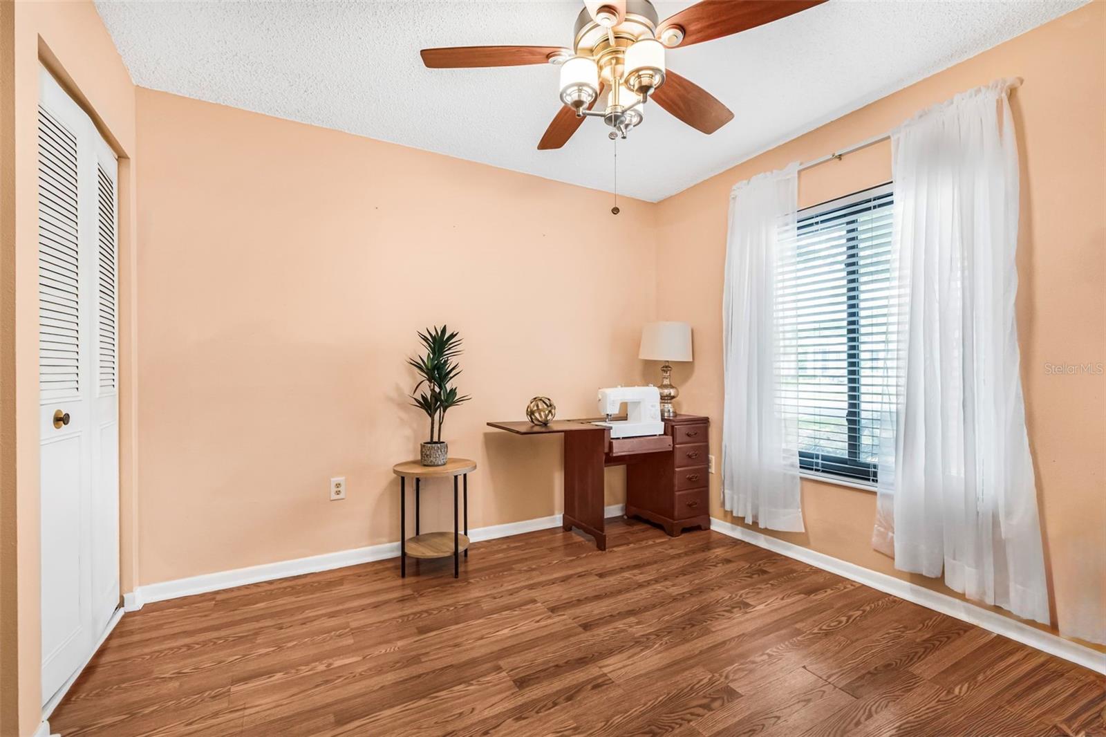 Bedroom #3 can easily serve as a home office or playroom, thanks to its convenient access through stylish double doors from the living room.