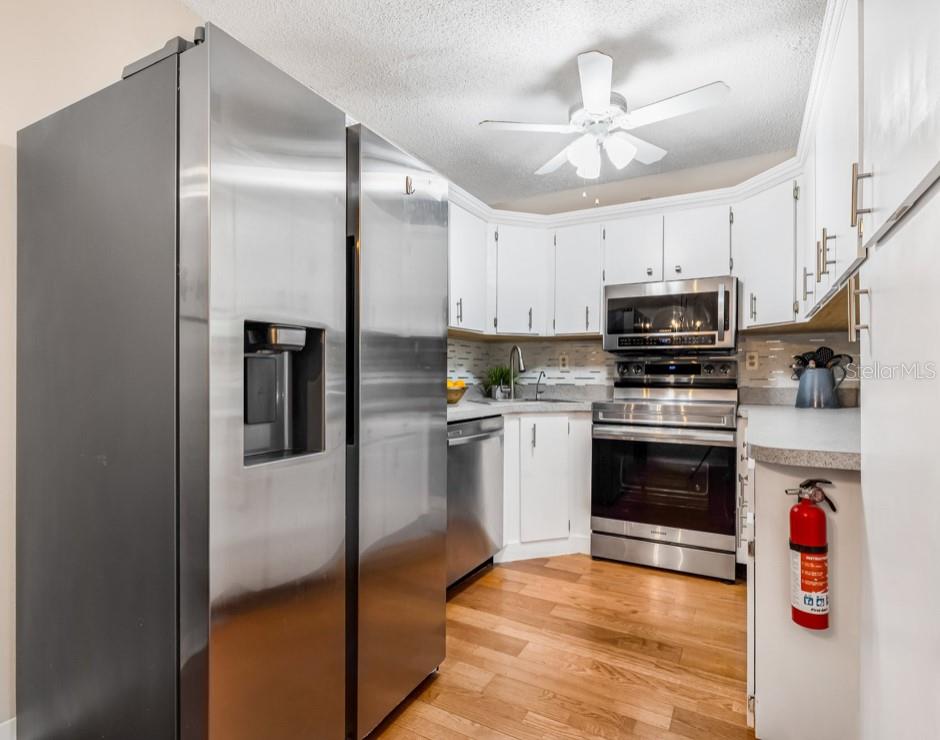 The kitchen is a chef’s delight, showcasing a high-quality stainless steel Samsung appliances (2022)