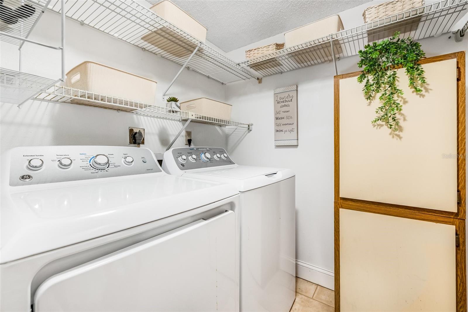 The dedicated indoor laundry room includes a new GE washer and dryer from 2023, making chores a breeze.