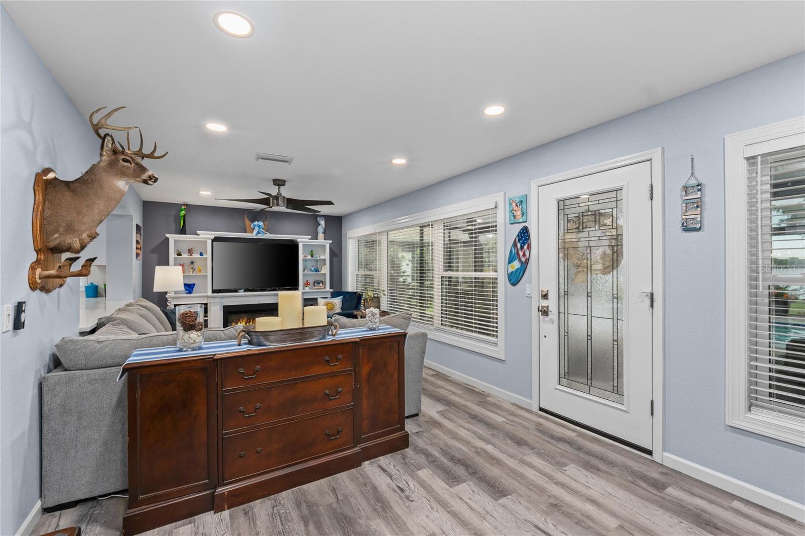 This large living space leads to the HUGE covered Lanai and Heated Saltwater Pool