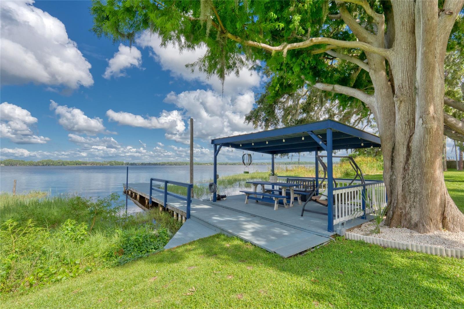 This covered space is perfect for entertaining or just relaxing dock side.