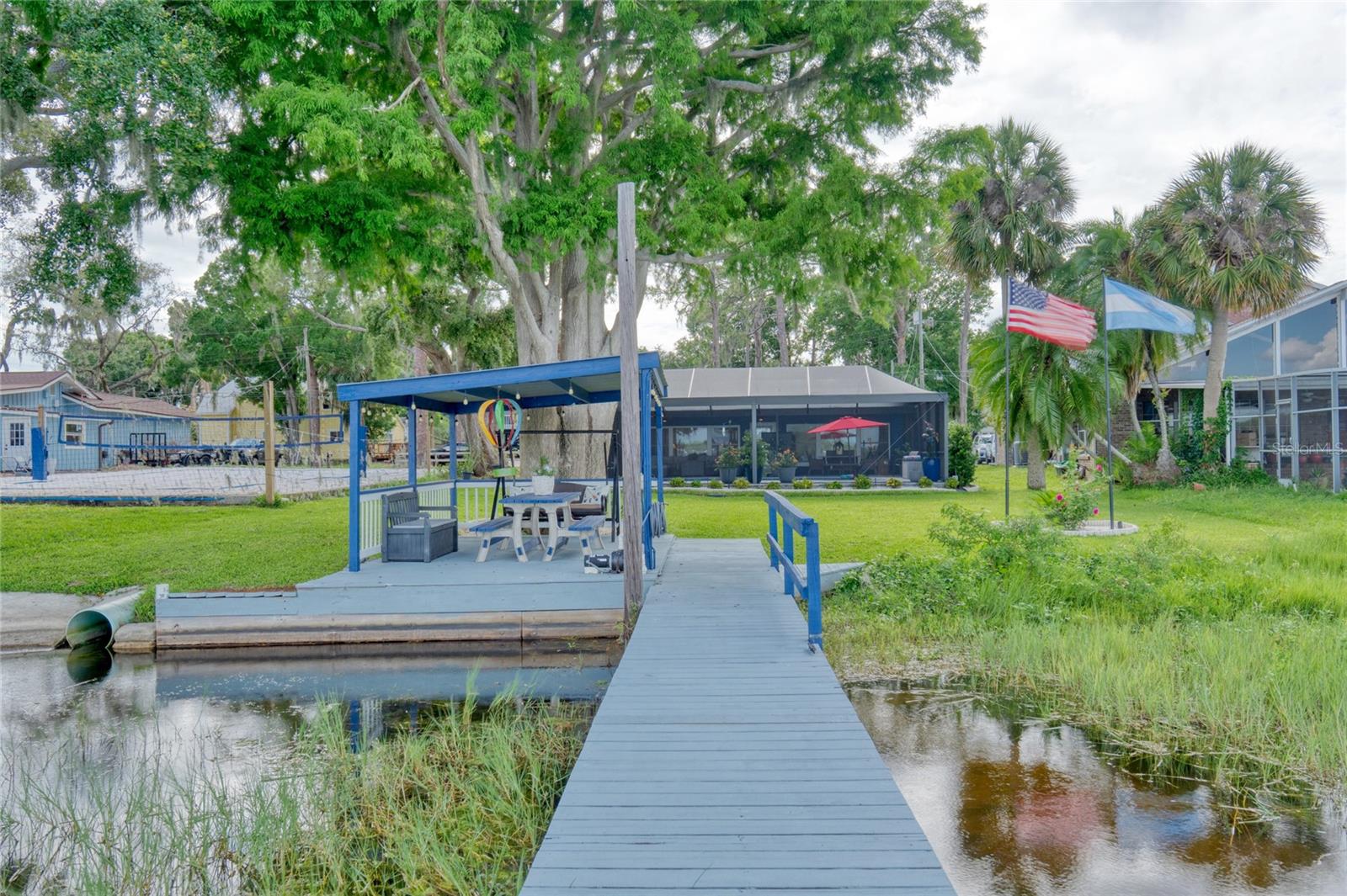 This Lakefront home has a screened in Heated Saltwater pool too