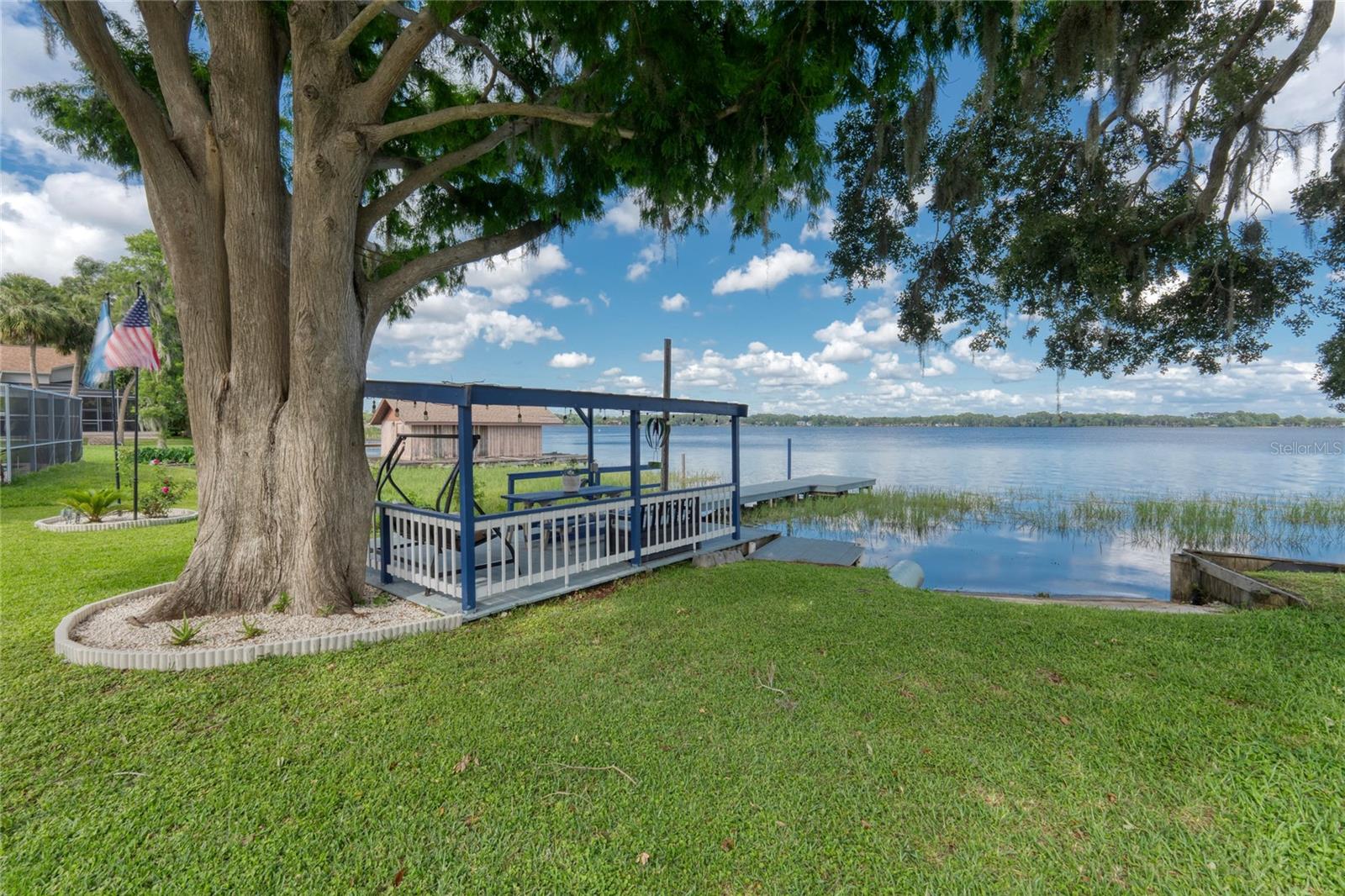 Mature trees offer shade in the back yard