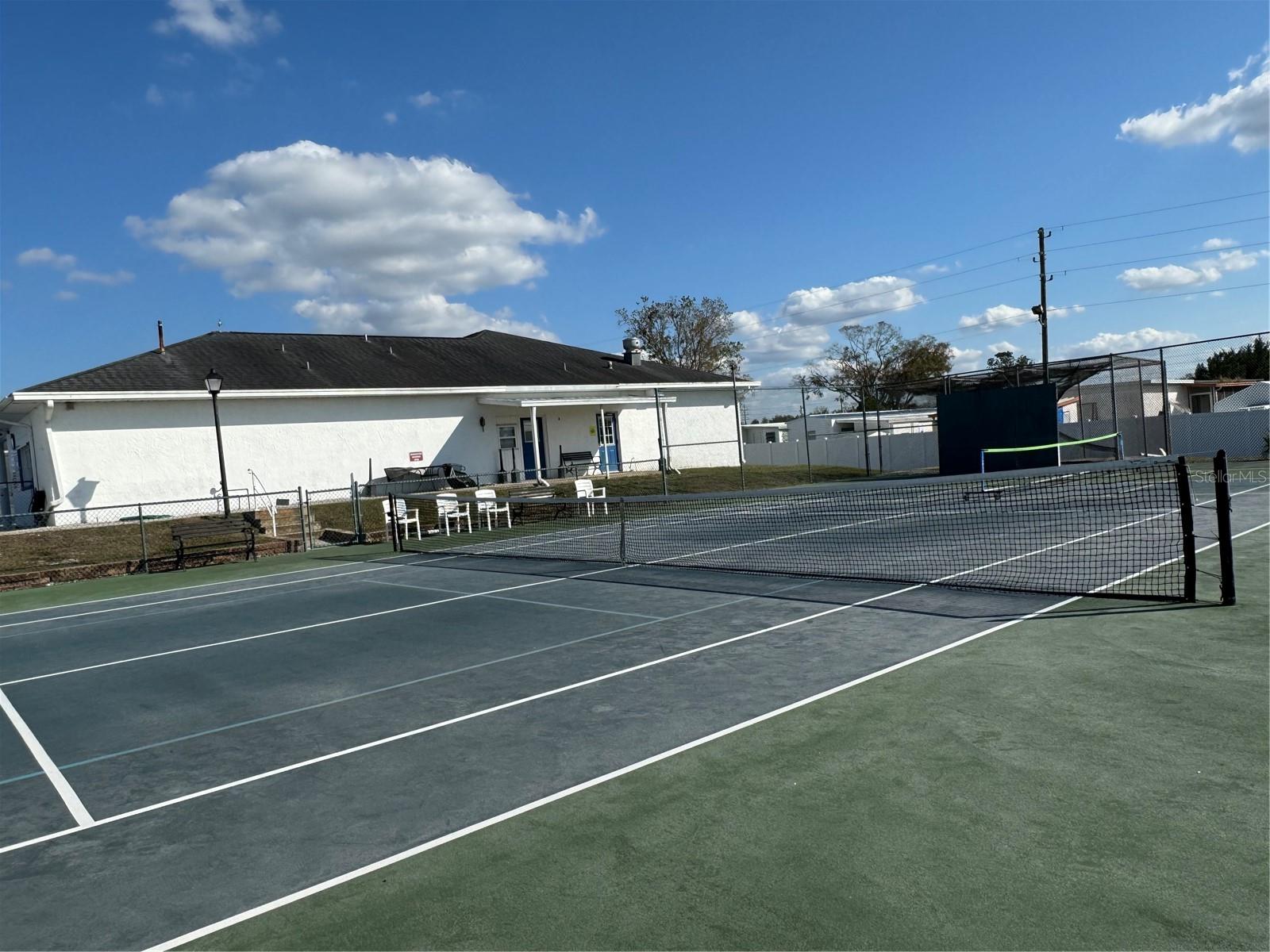 Tennis Court with clubhouse in the background