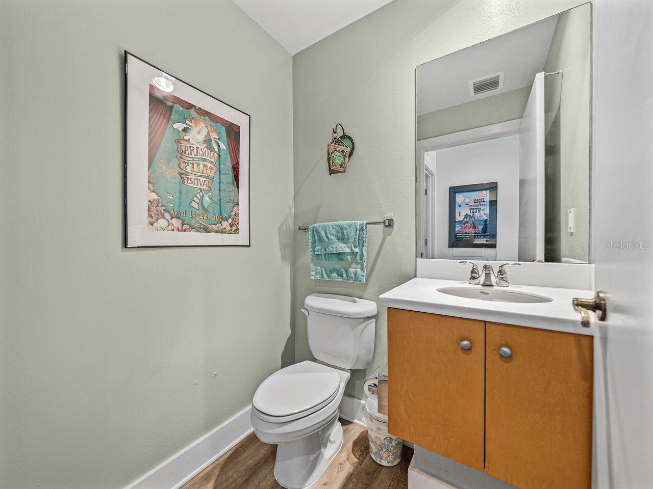Half bath located in hallway after kitchen.