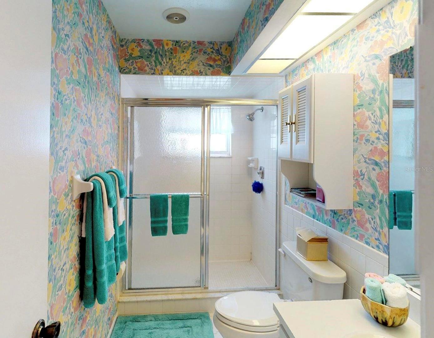 Main bath is spacious and bright