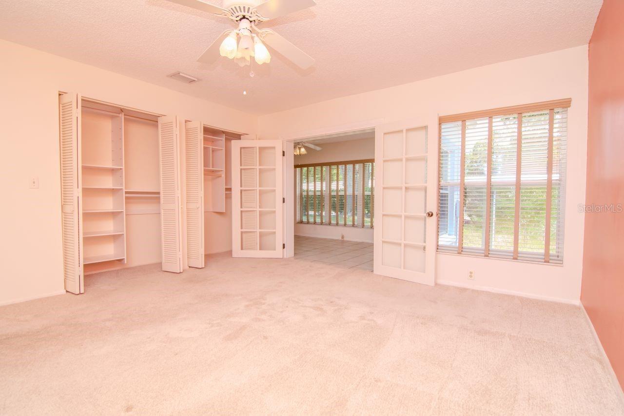 Primary closet offers a custom closet design to maximize storage.