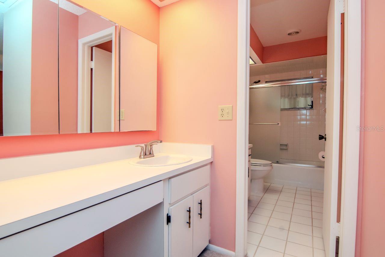 Dressing area for the primary suite with a view into primary bath.