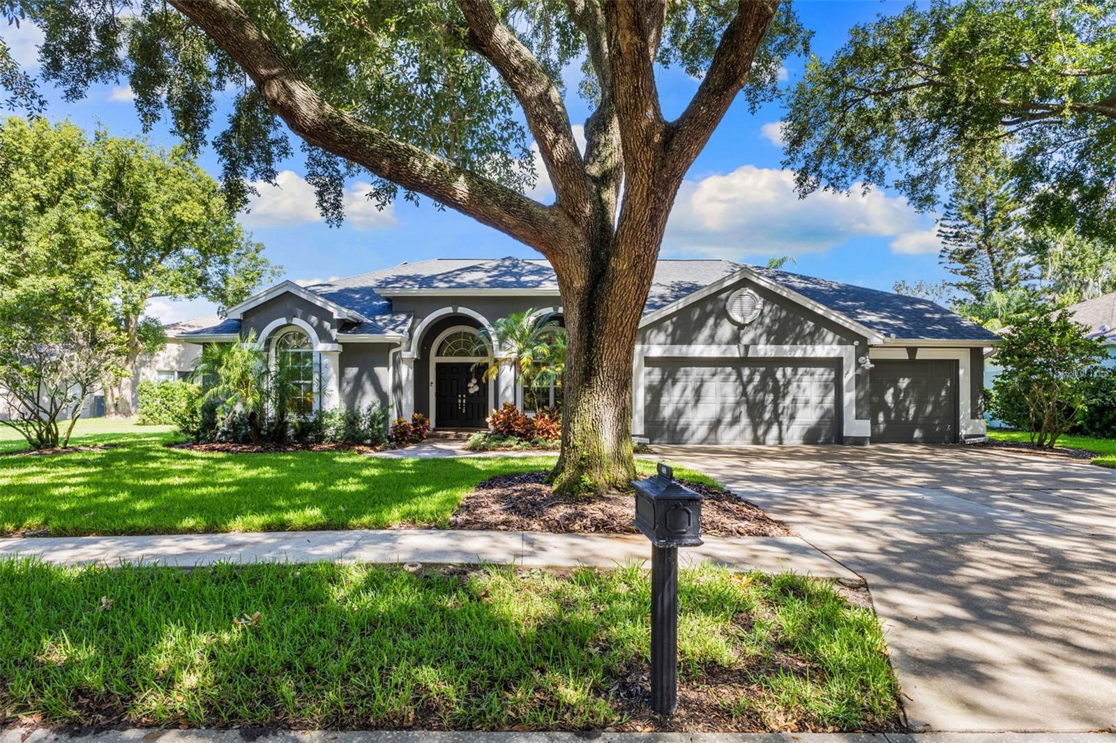 Front of Home with Beautiful Shade Trees