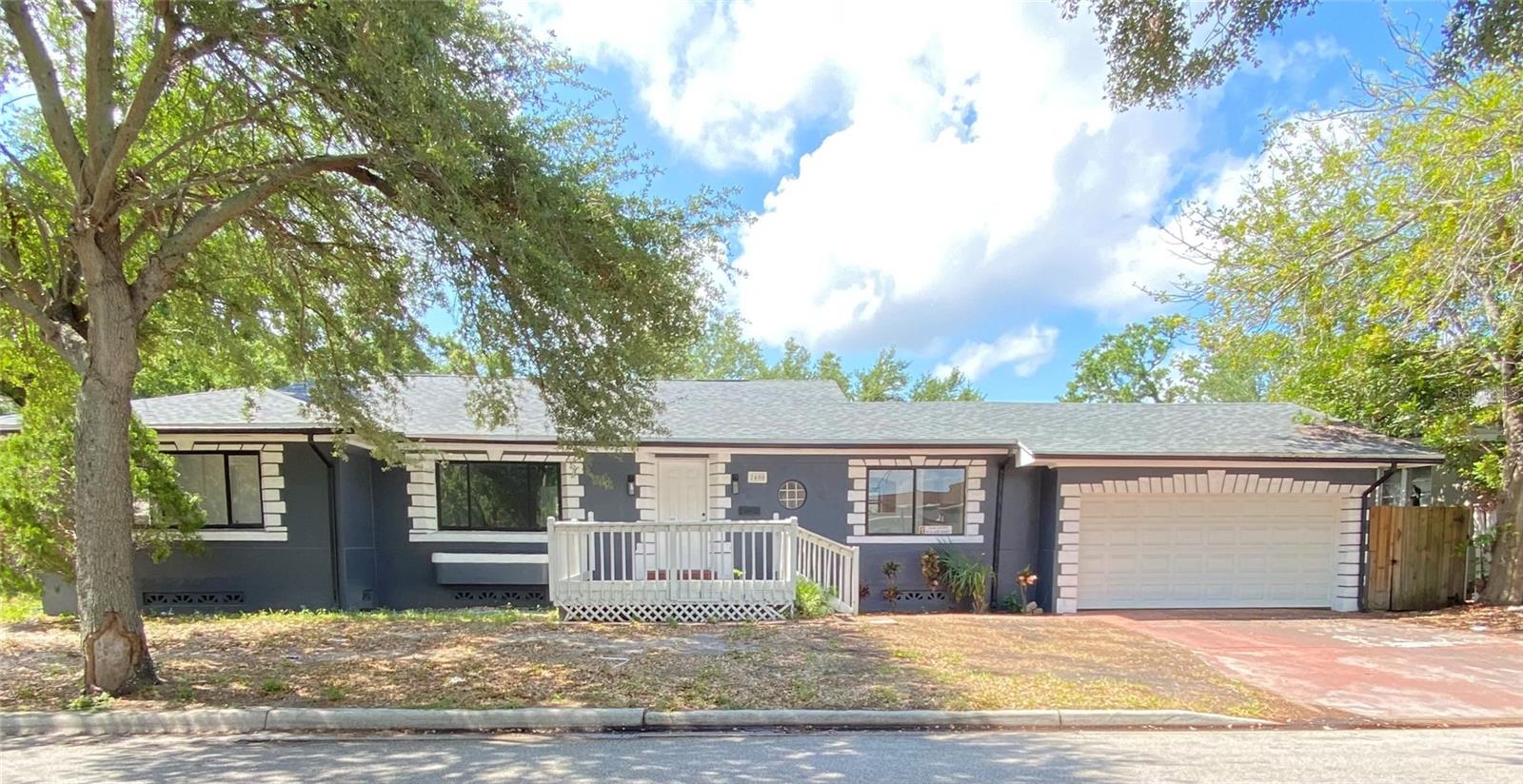 Incredible block/stucco 3-bedroom / 2.5-bathroom home with crawlspace and 2 car garage on a double lot.