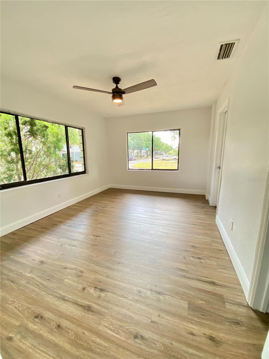Primary bedroom with a plethora of natural light and on suite bathroom