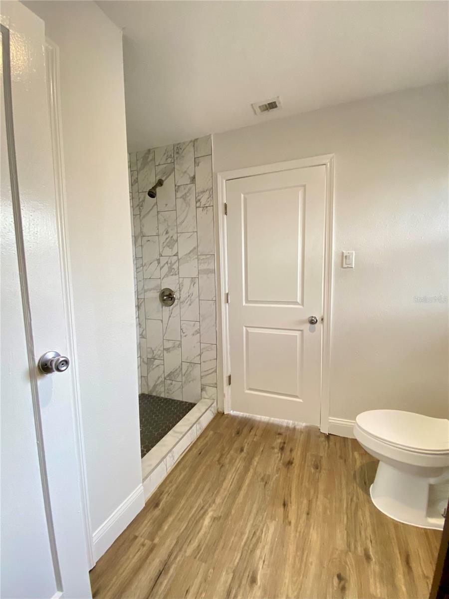 Primary bathroom view from second access door from second bedroom