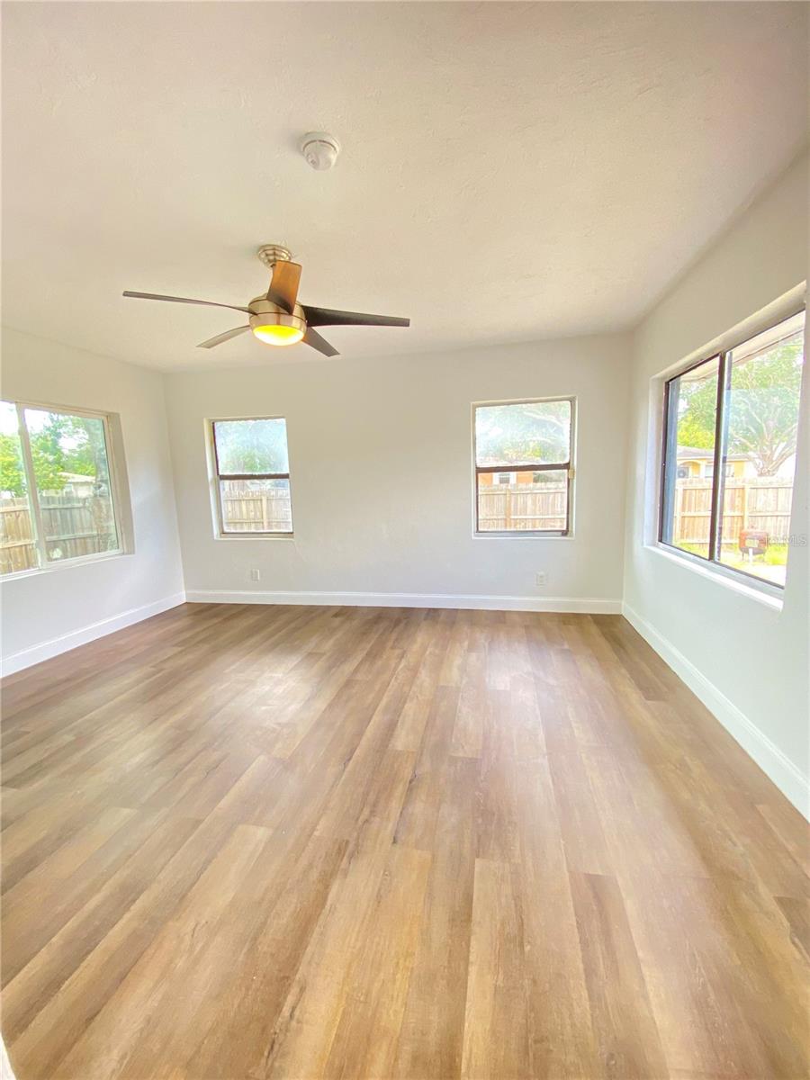 Third bedroom with surround view of the back yard and access to second bathroom from on-suite