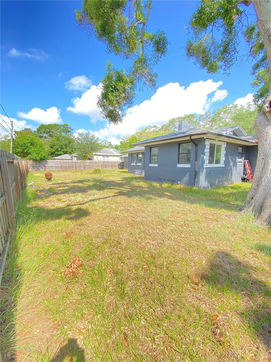 Back left side corner view to backyard in rear of home