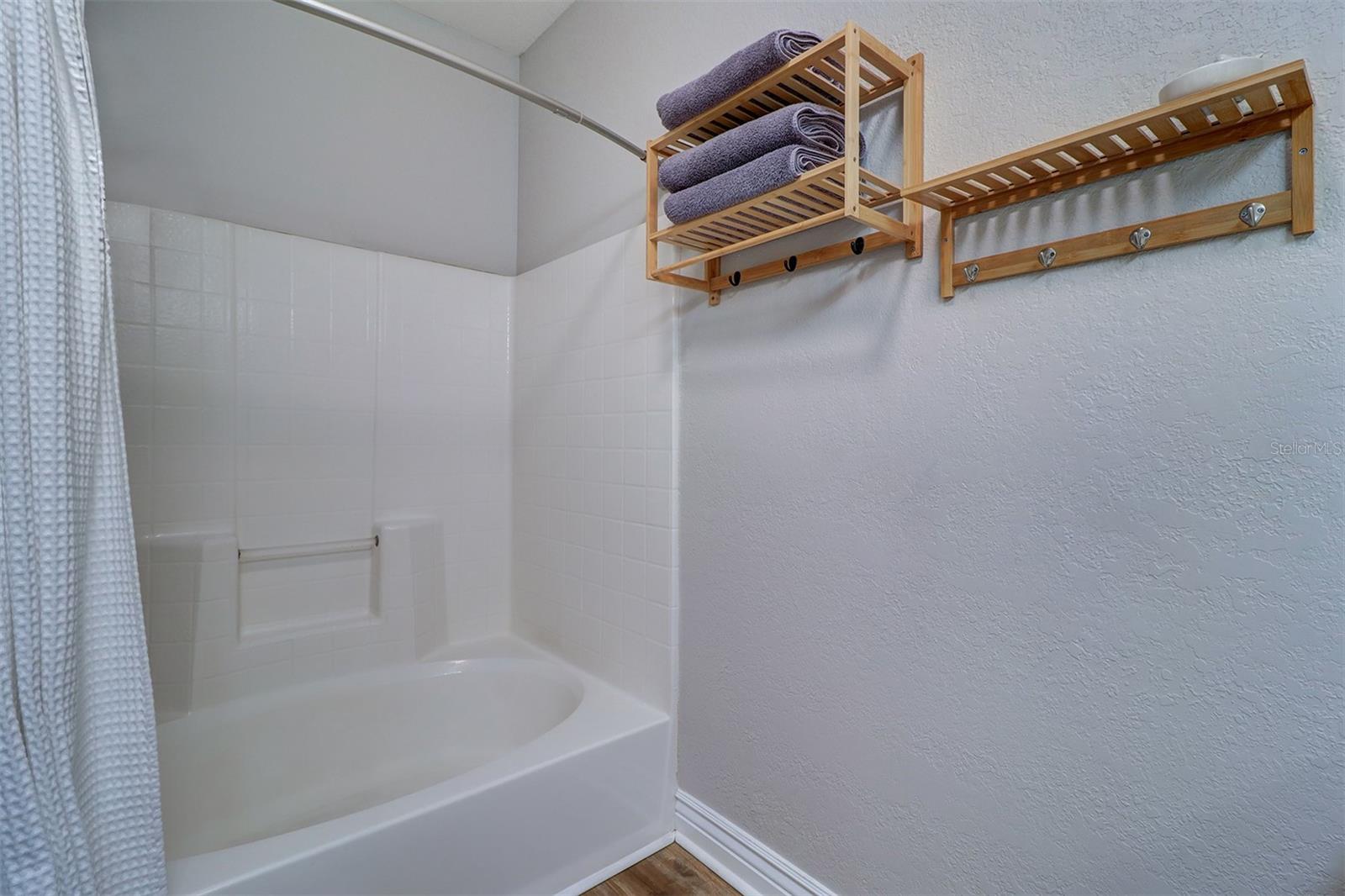 Updated primary bathroom with new vanity, vessel sink, mirror and light fixture