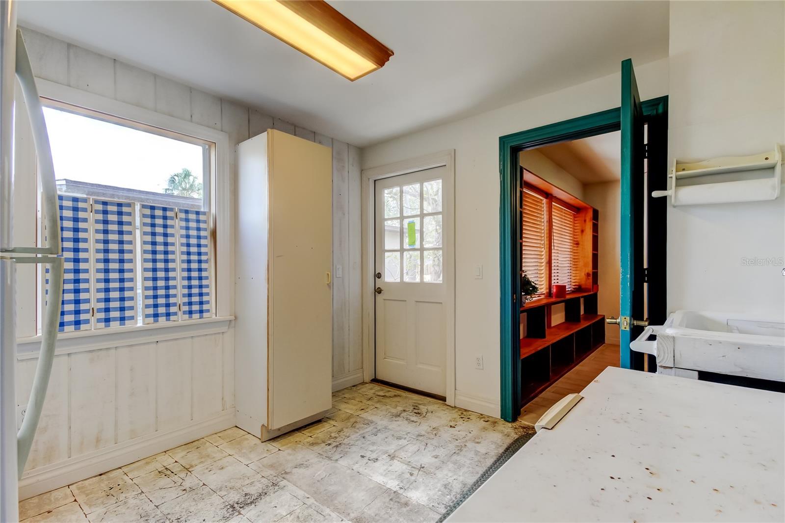 Utility room w/ door to outside & Office