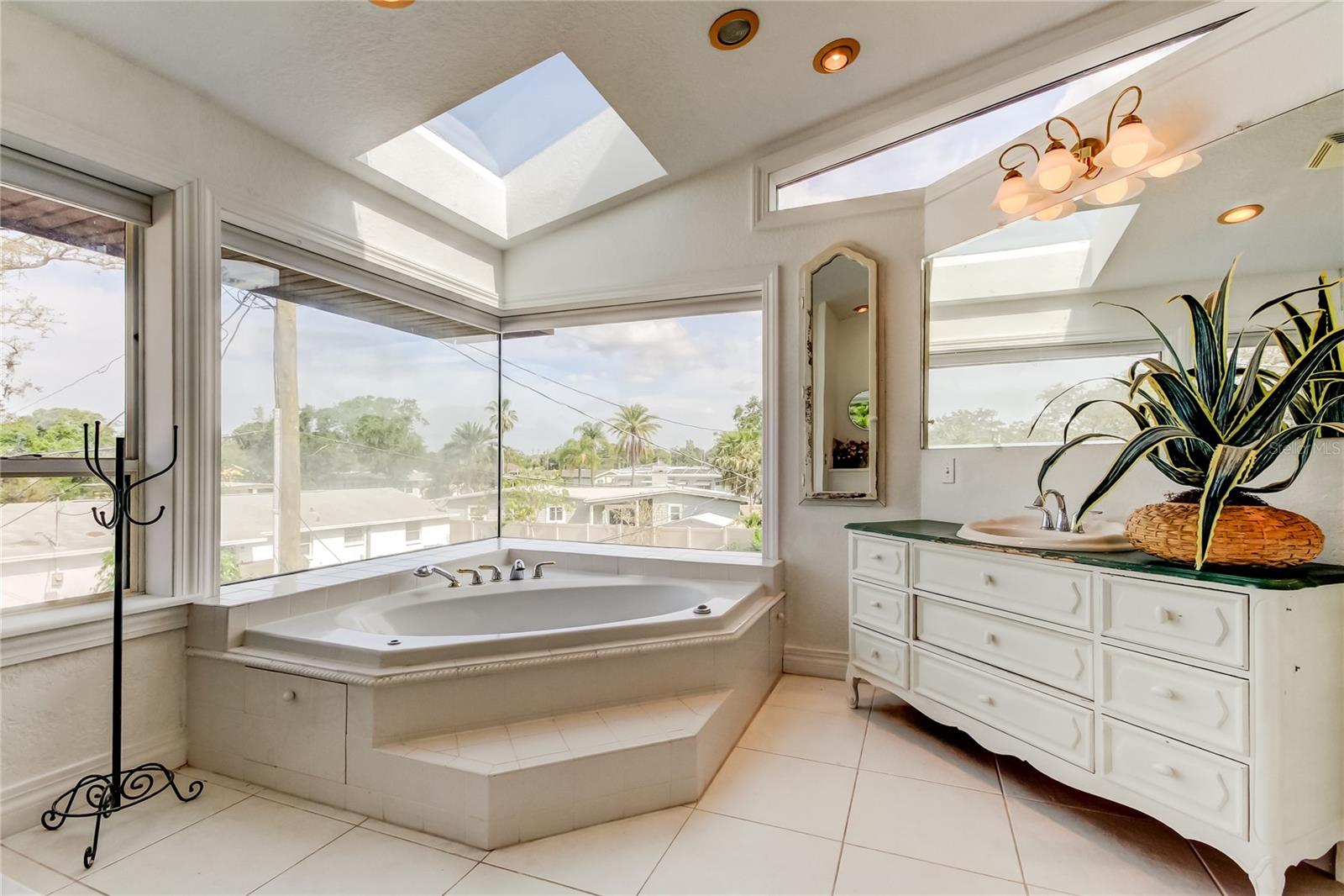 tub and additional vanity.