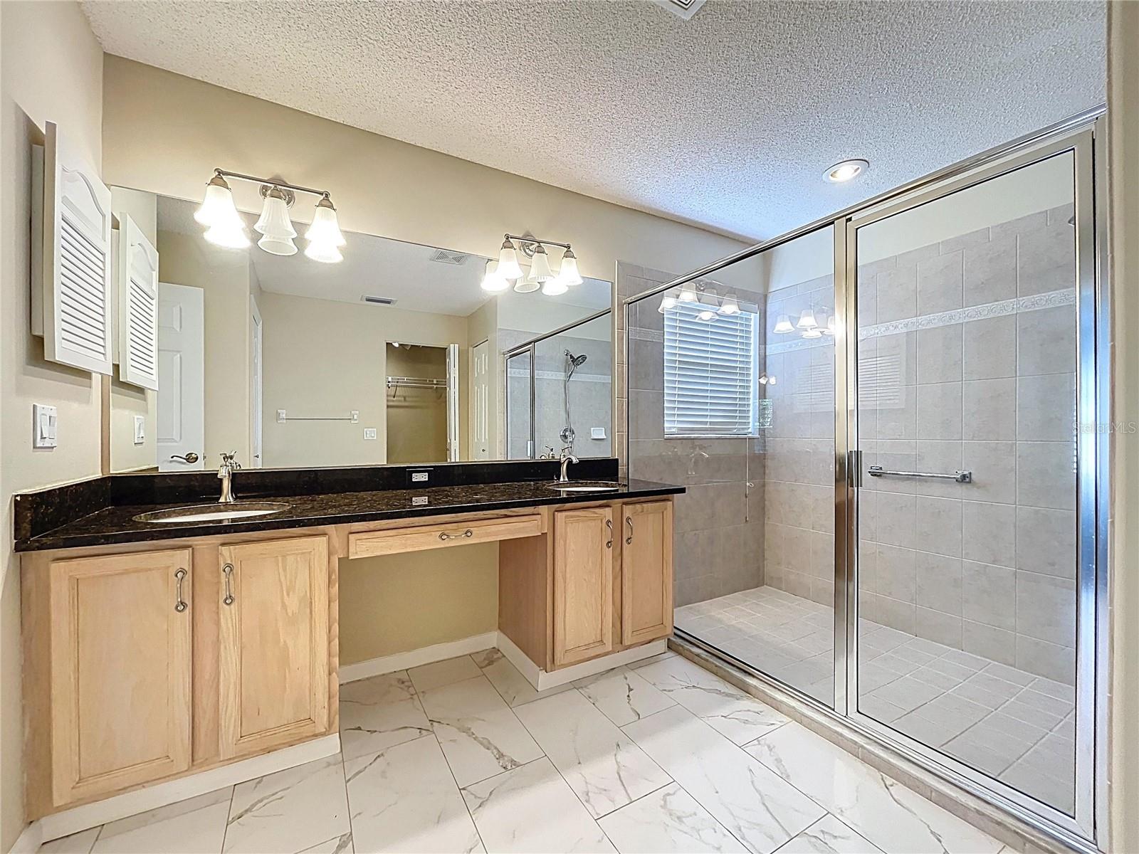 Double vanities with granite countertop