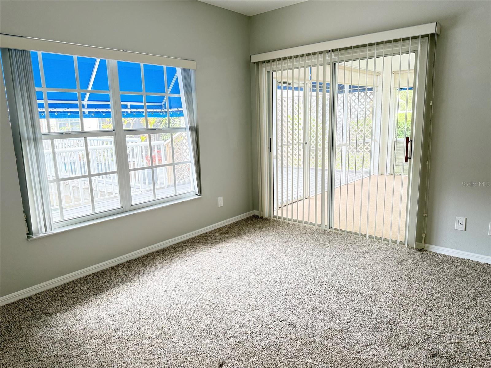 Primary Bedroom with sliders to screened porch