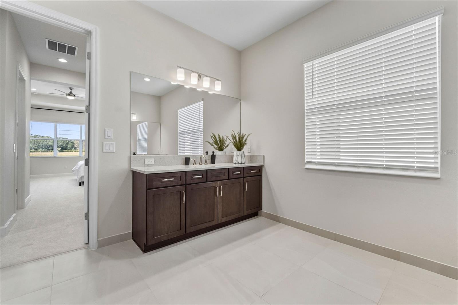 Primary Bathroom Offers Separate Dual Sink Vanity