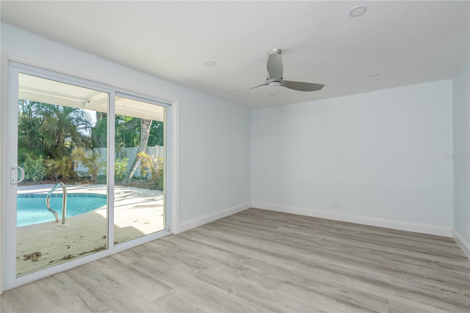 Primary Bedroom with sliding doors to pool.