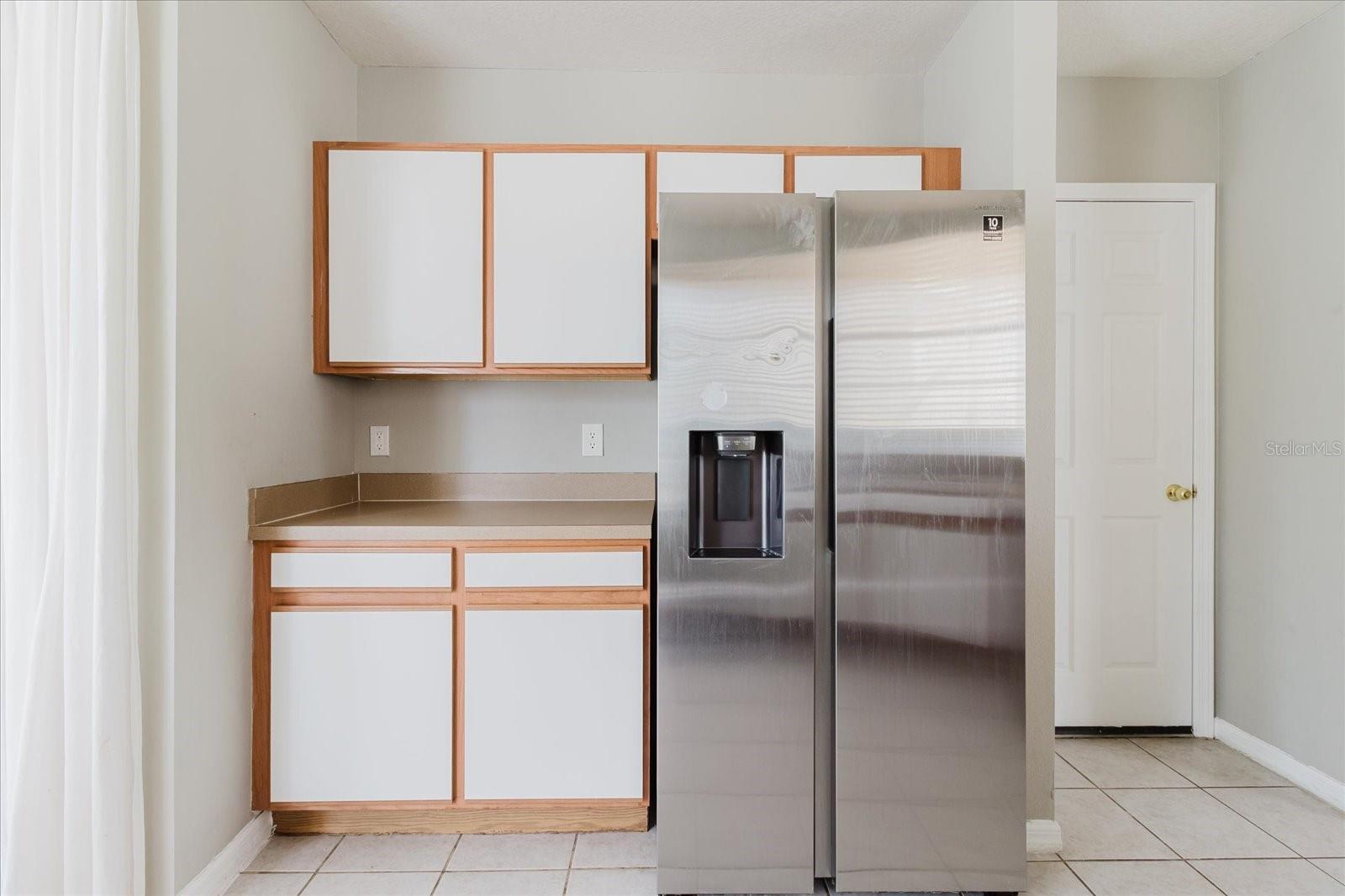 View of Refrigerator With Door To Garage On The Right 1
