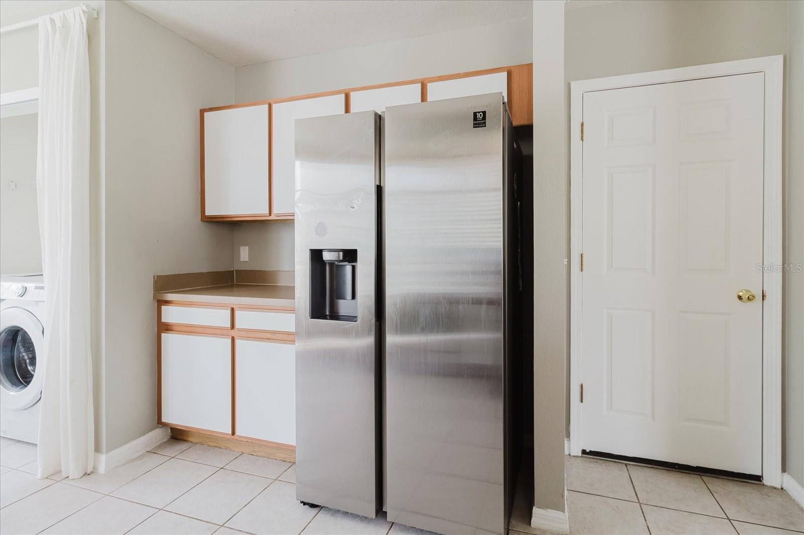 View of Refrigerator With Door To Garage On The Right 2