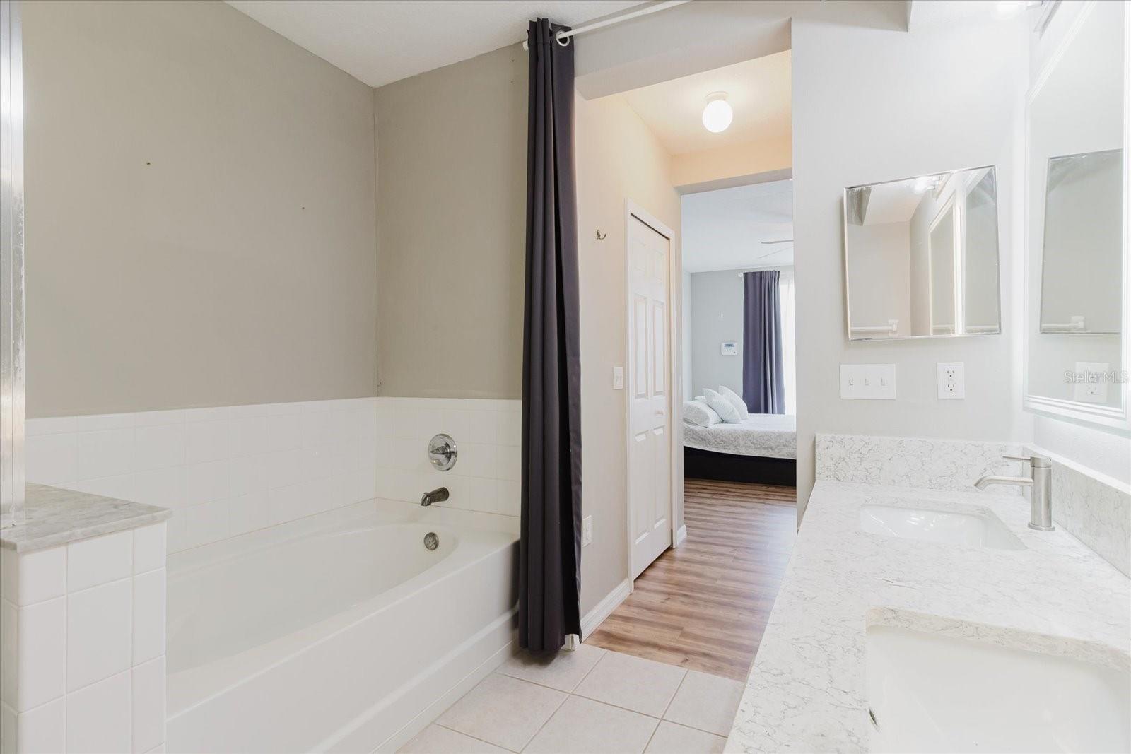 Full En Suite Bath With Dual Vanities, Walk In Shower, And A Separate Tub 4