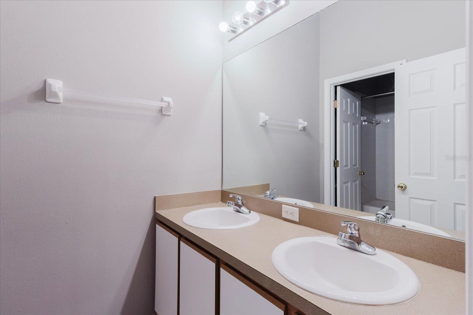 2nd Bathroom That's Upstairs With A Double Vanity & Tile Floors