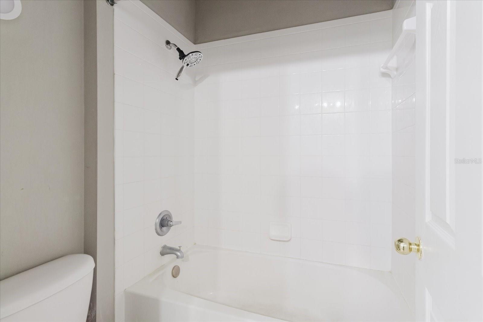 2nd Bathroom With A Tub Shower Combo & Tile Floors