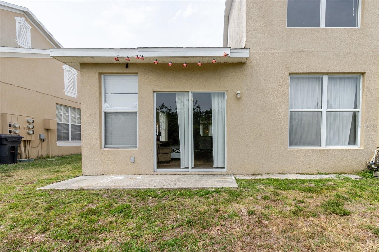 Outside Of Sliding Glass Door That Leads To The Living Room