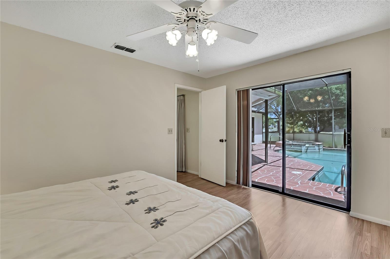 3rd bedroom with sliders to pool lanai