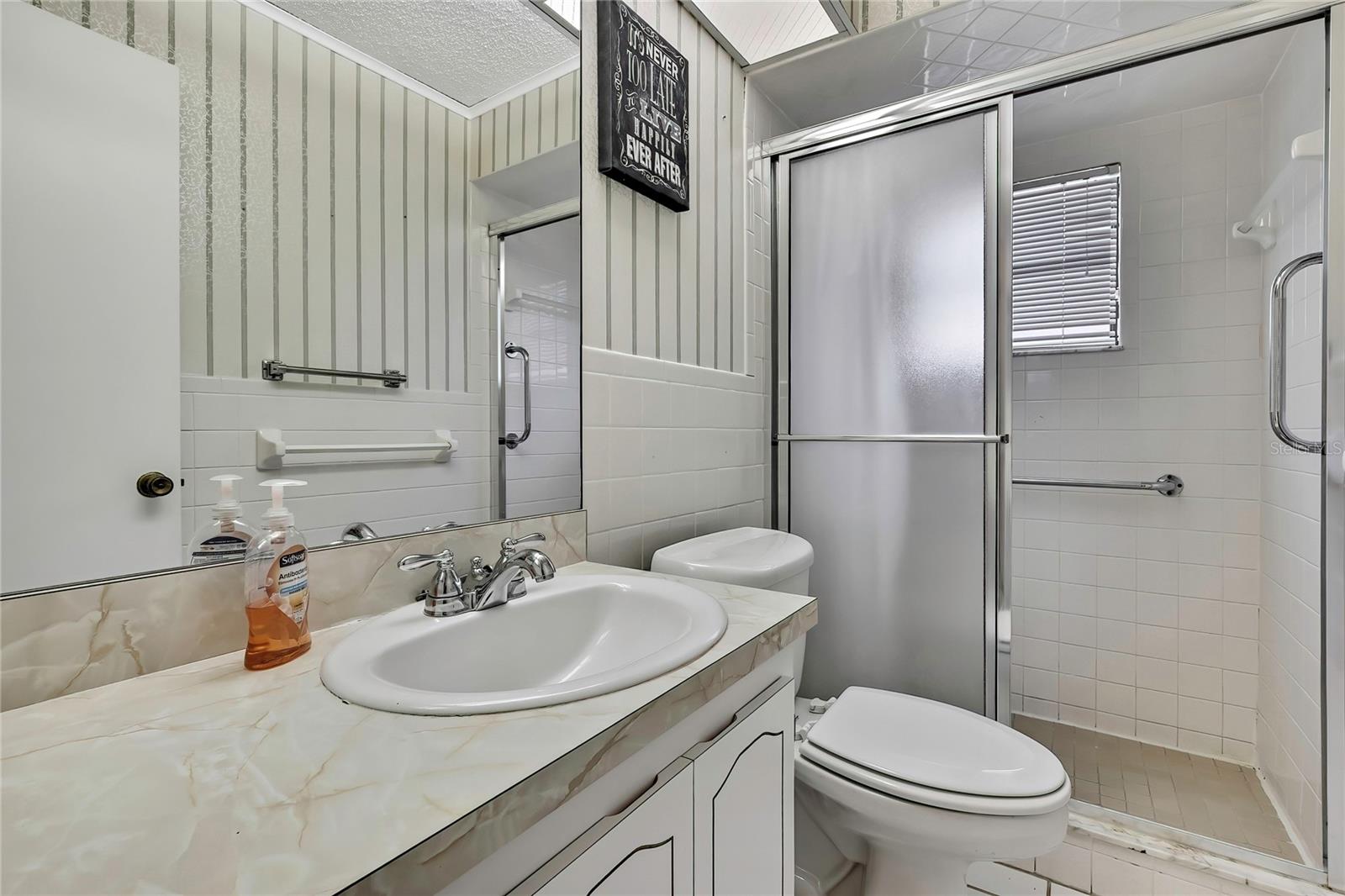 bathroom off kitchen closest to garage